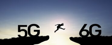 Technology transformation change from 5G to 6G , Silhouette businessman jumping from 5G cliff to 6G cliff on blue sky.